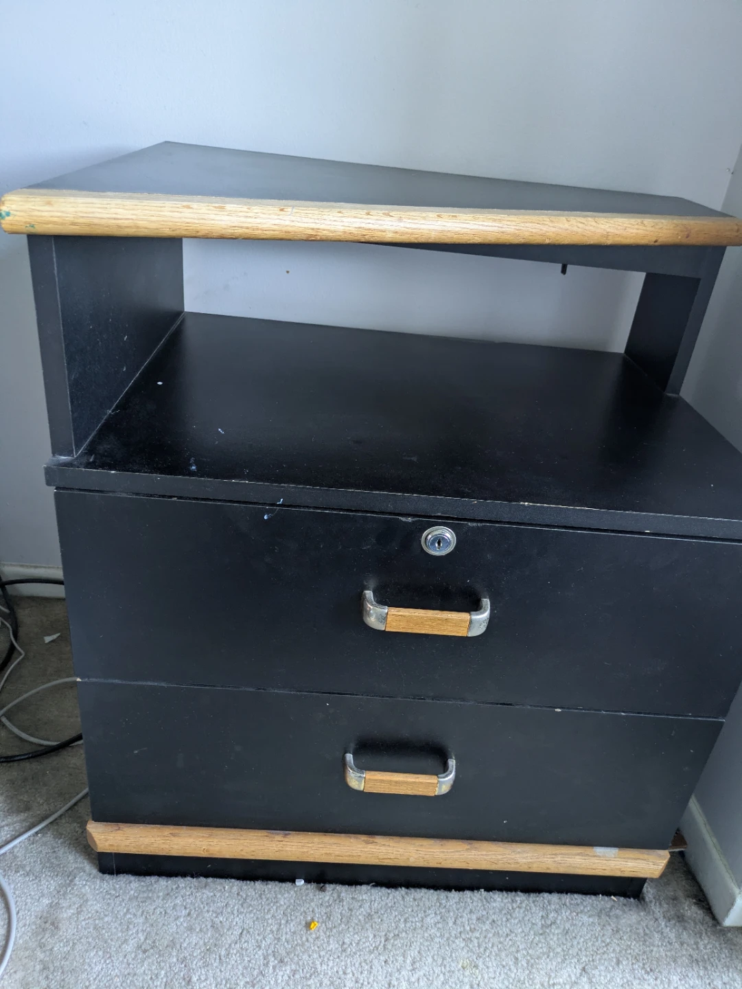 Black two-drawer filing cabinet with wood accents