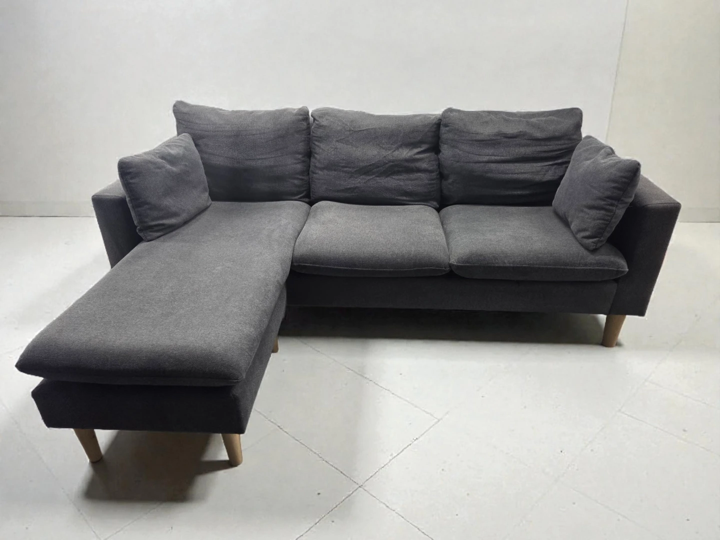 Small grey sectional with reversible chaise