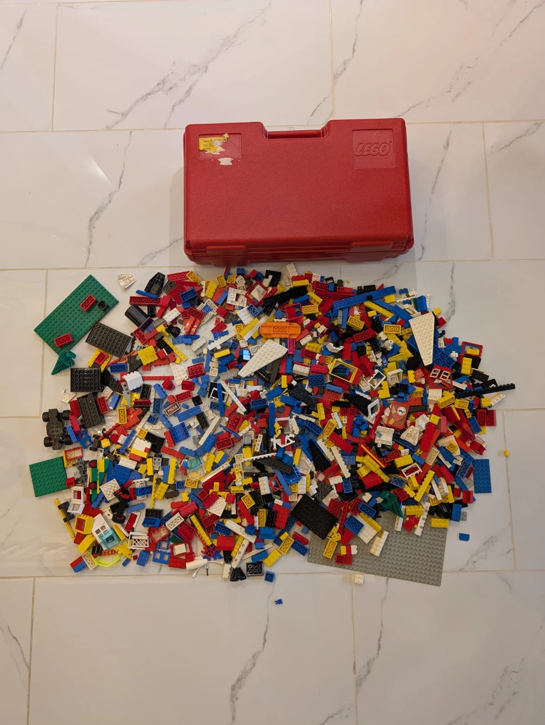 Vintage LEGO pieces with Red Storage Case
