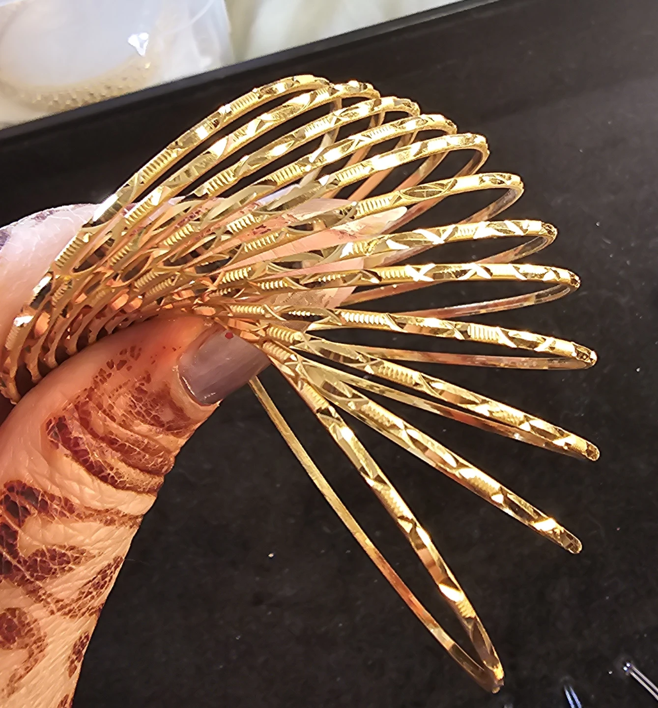 Set of 12 thin Gold Tone Bangles