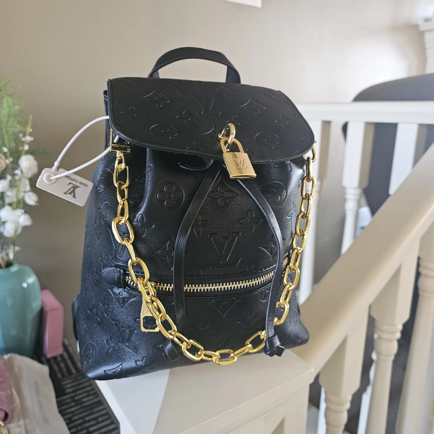 Louis Vuitton Black Backpack with Gold Chain