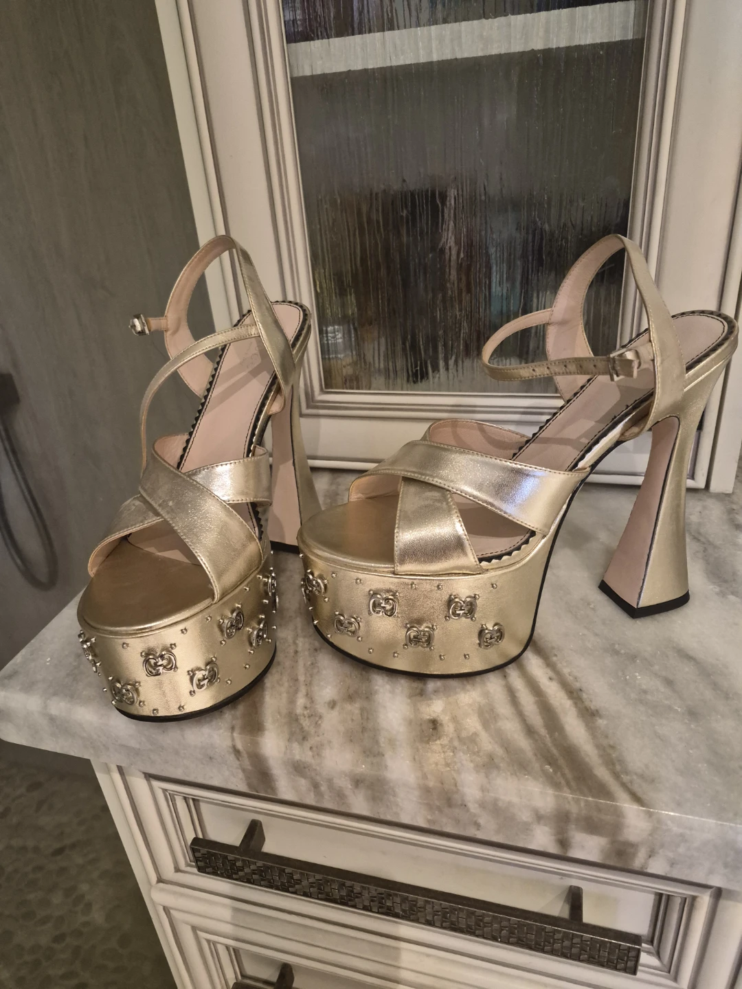 Brand new Gold Gucci platform heels.  Size 8.5