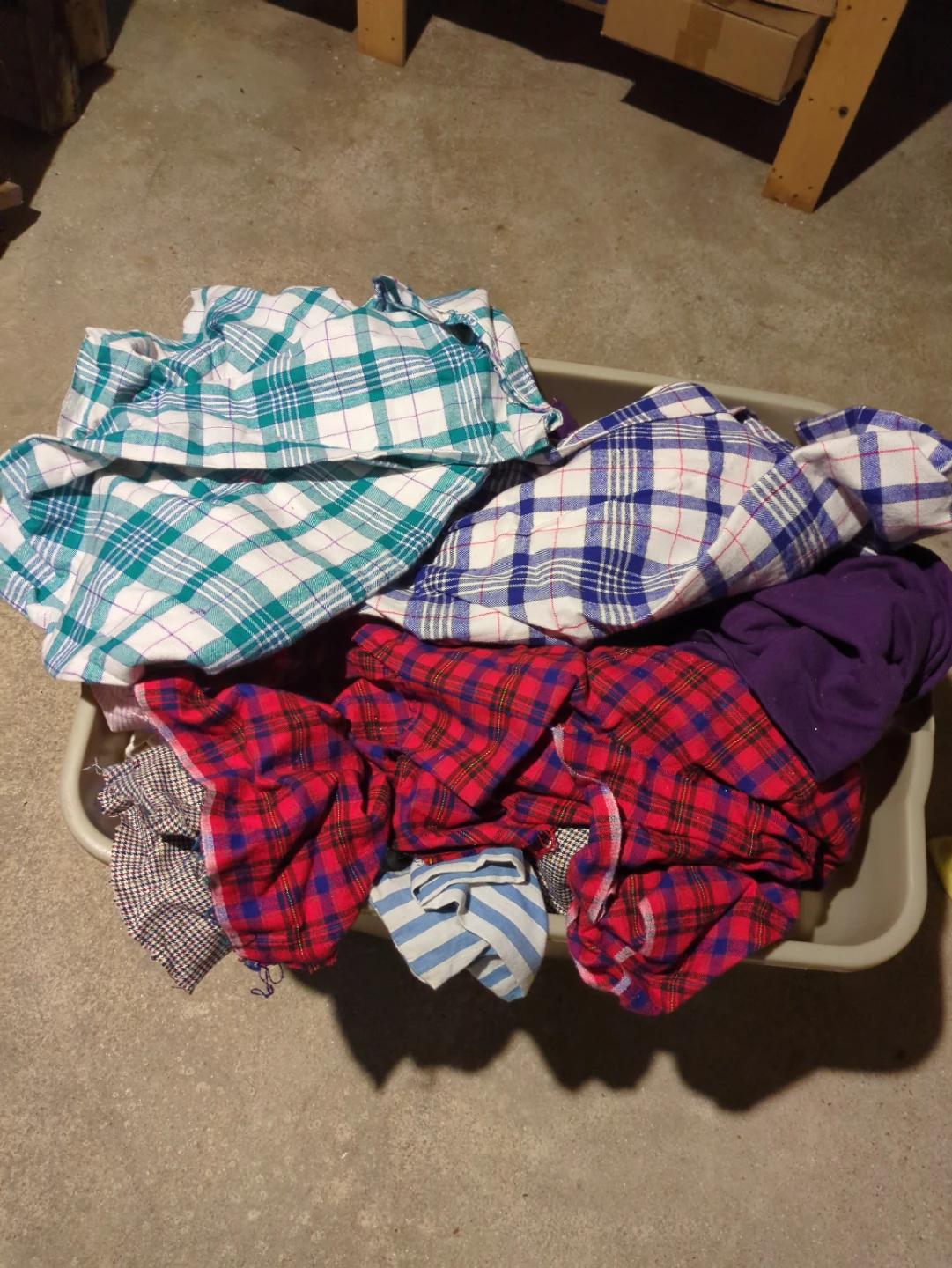 Bundle of woven and knit fabric remnants in different sizes.