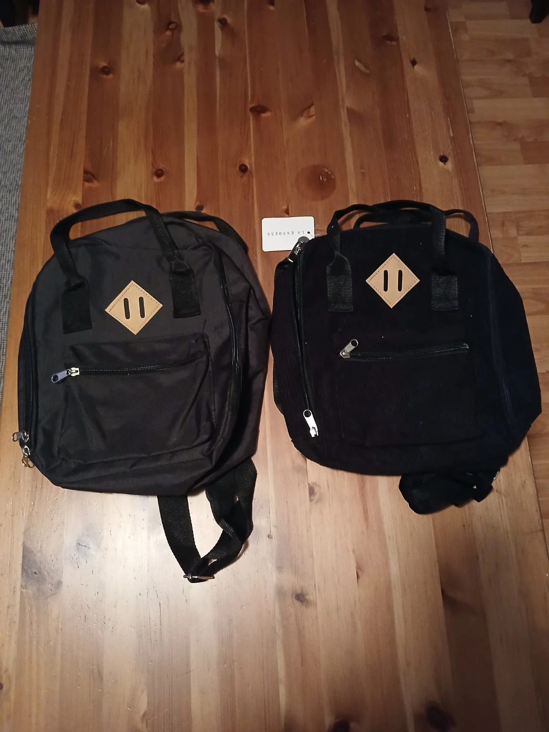 Two Black Mini Backpacks