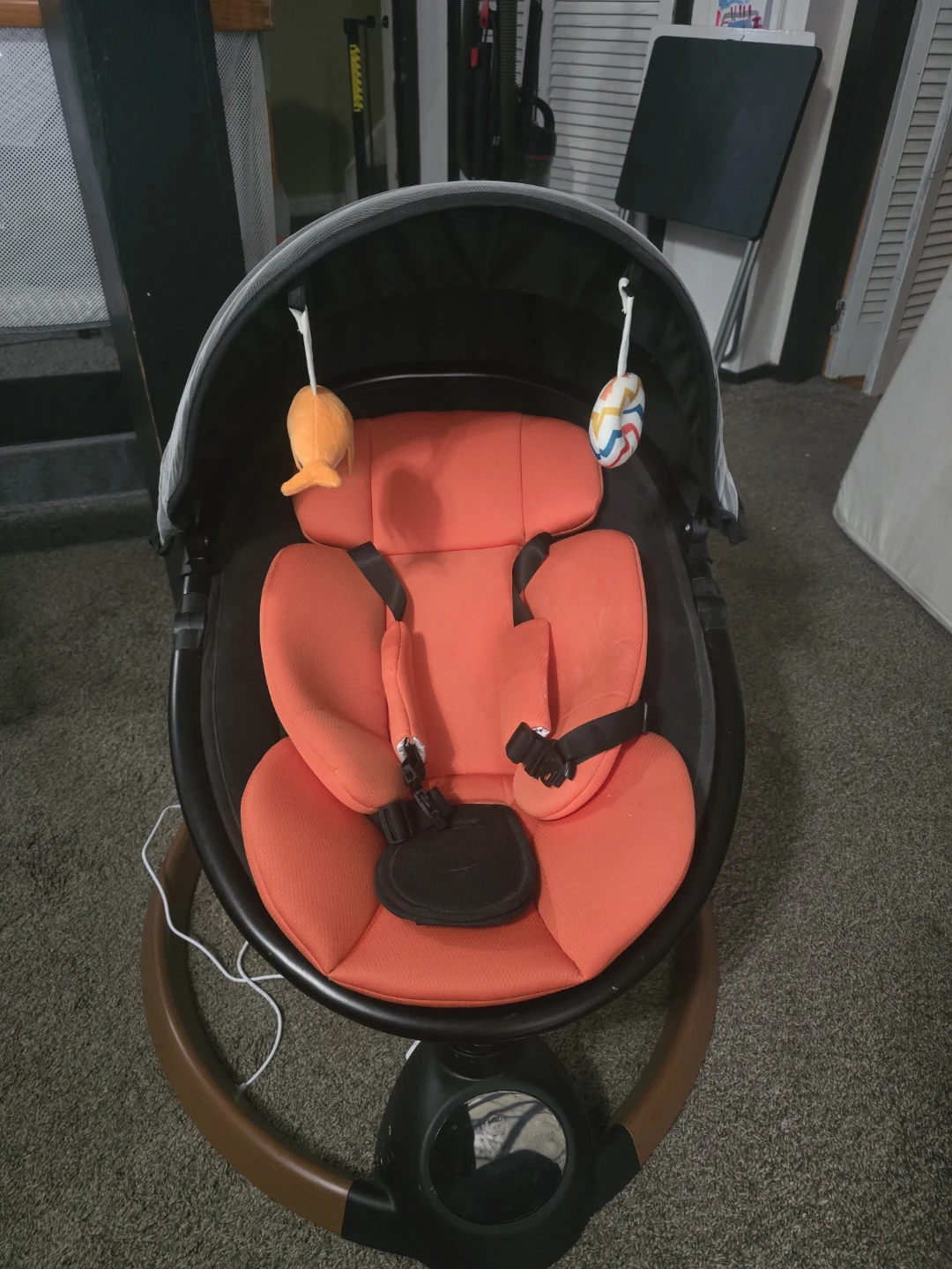 Baby Rocker with Orange Seat and Toys
