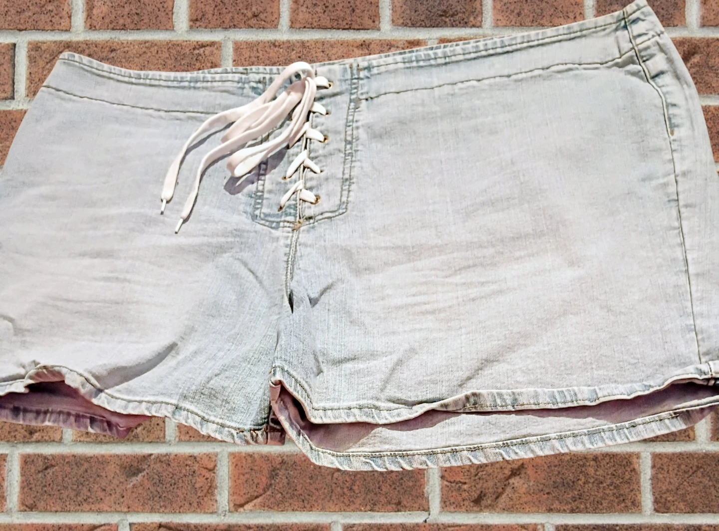 Women's jean shorts W/Ties on front/Back size 23/24
