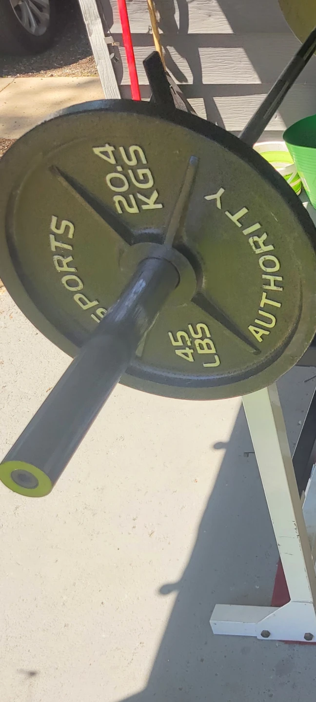 OLYMPIC 7' BAR.   90LBs  2-45s. IN GOOD CONDITION
