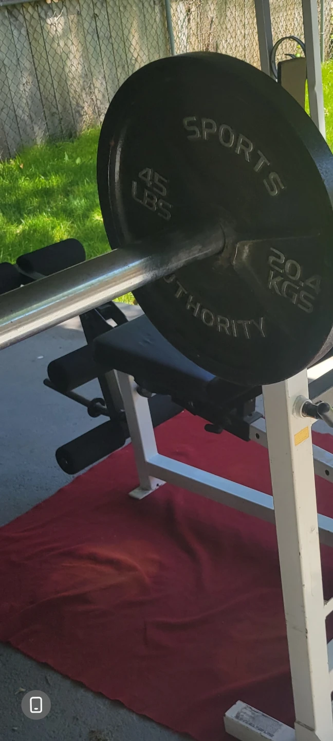 OLYMPIC 7' BAR.   90LBs  2-45s. IN GOOD CONDITION - photo 2