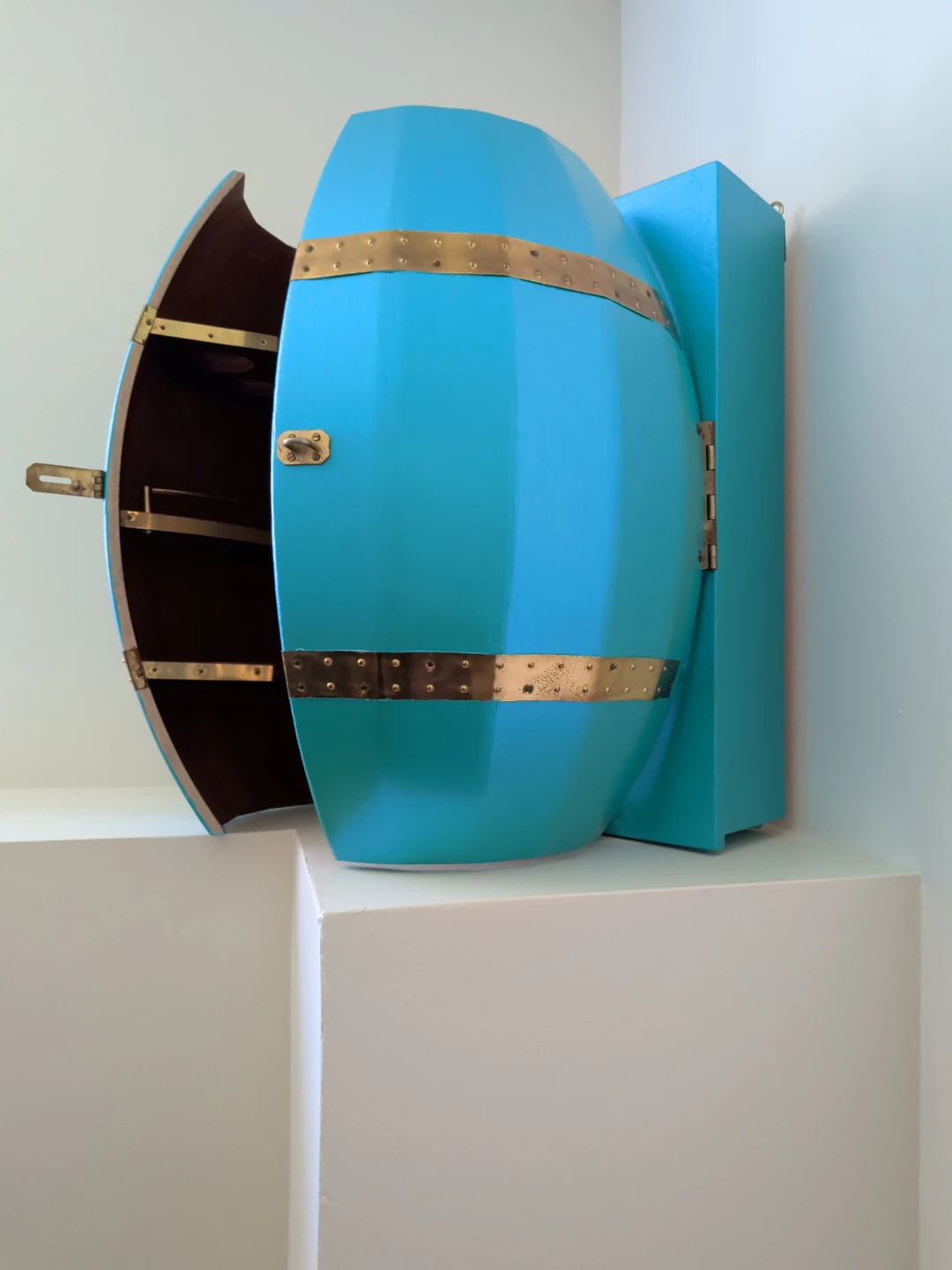 Barrel shaped bar cabinet