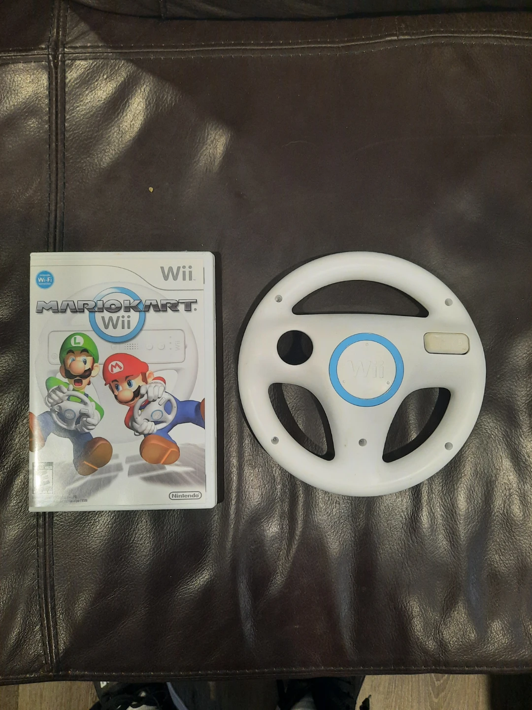 Mario Kart Wii game and steering wheel for Nintendo Wii