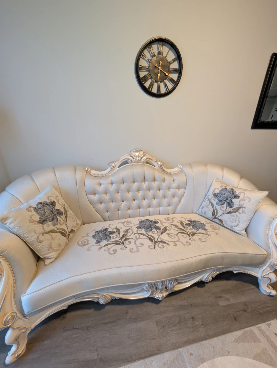 Victorian Style Sofa with Tufted Back and Floral Pillows