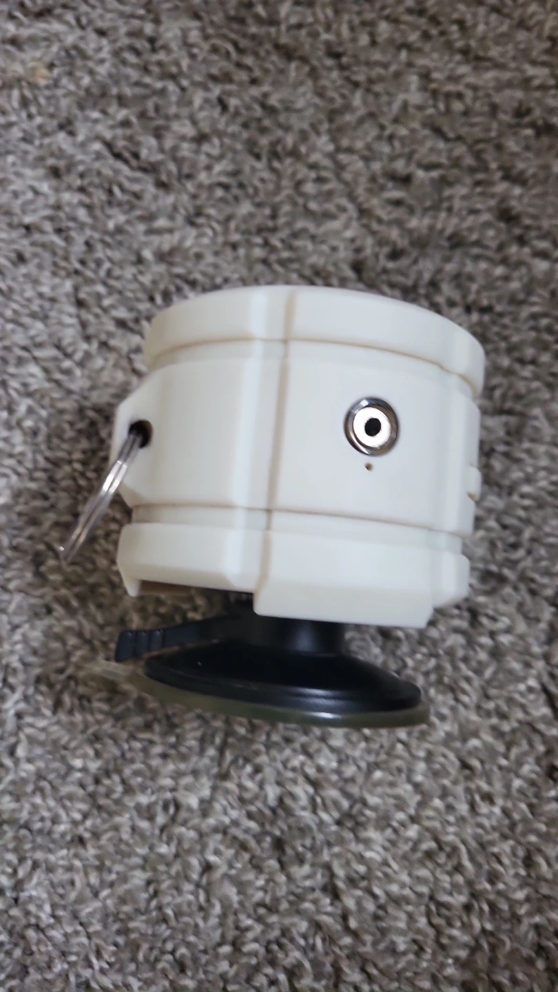 White portable speaker with suction cup mount