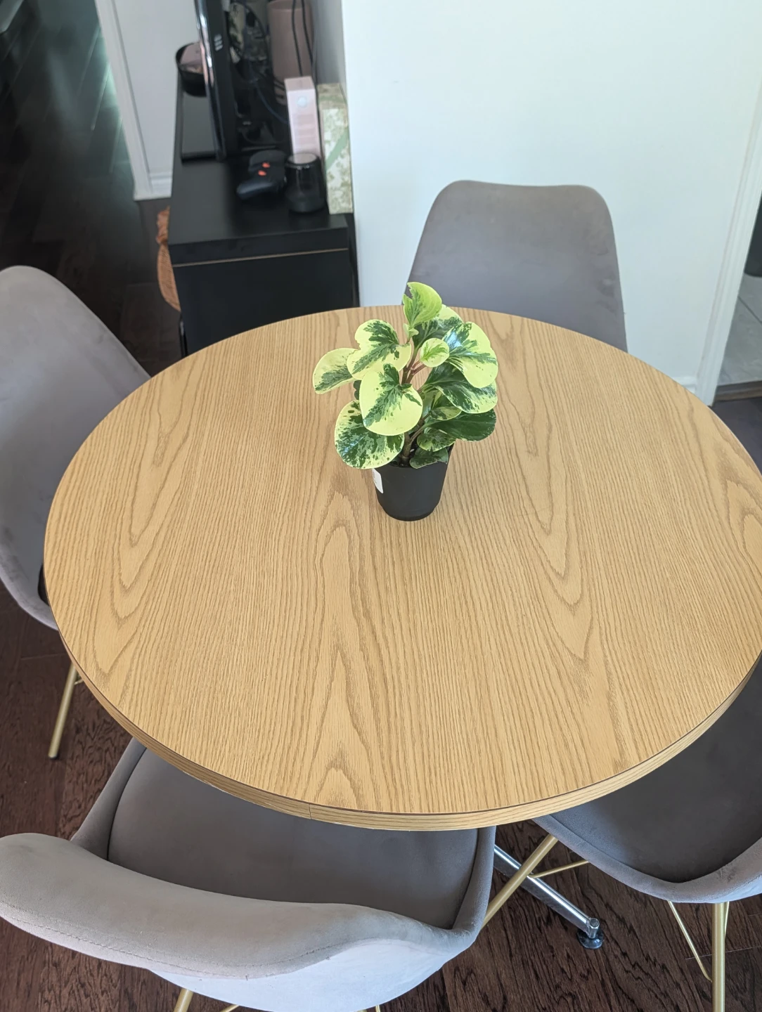 Round wood-look dining table