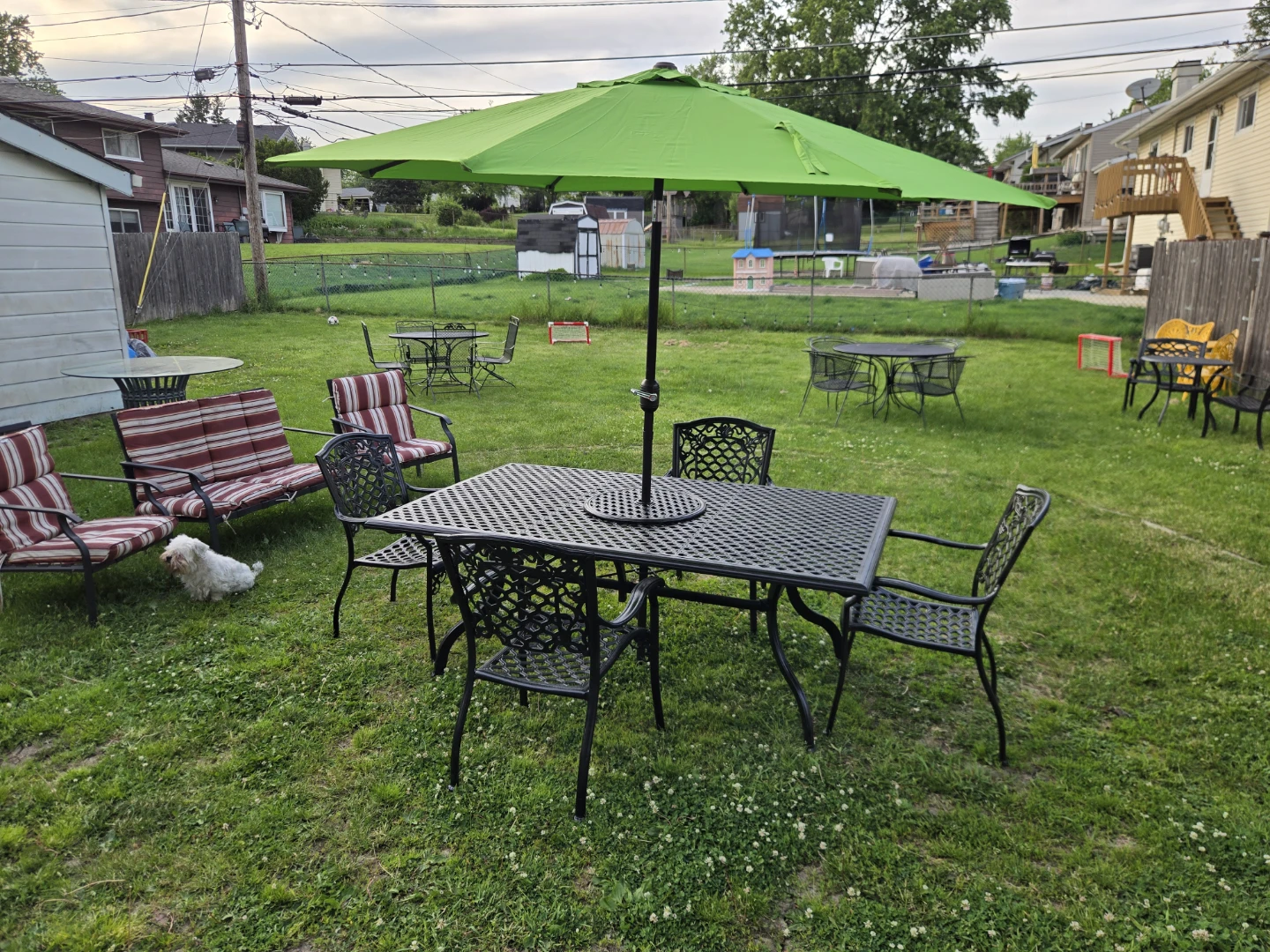 Black Metal Patio Dining Set with Green Umbrella