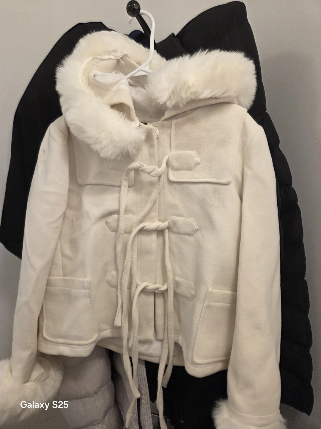 Cream white hooded toggle coat with faux fur trim