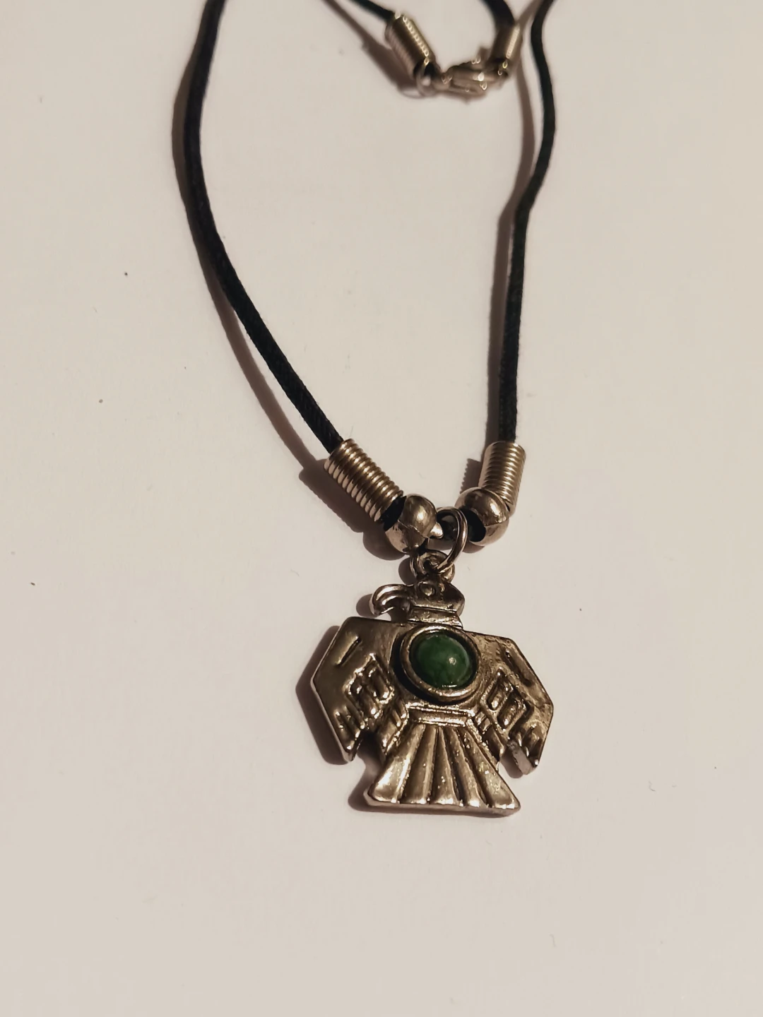 Silver Tone Thunderbird Pendant Necklace with Green Stone