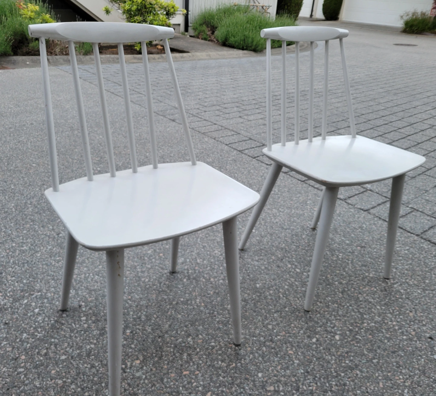 Two White Spindle Back Chairs. $25 Each.
