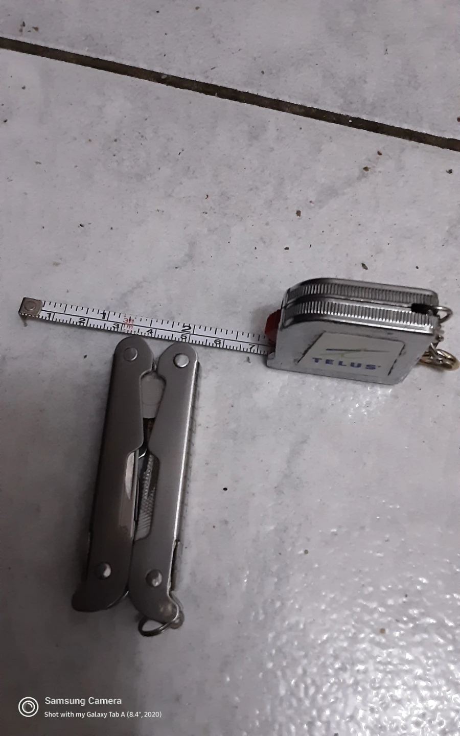 Multi-tool and TELUS Tape Measure - photo 2