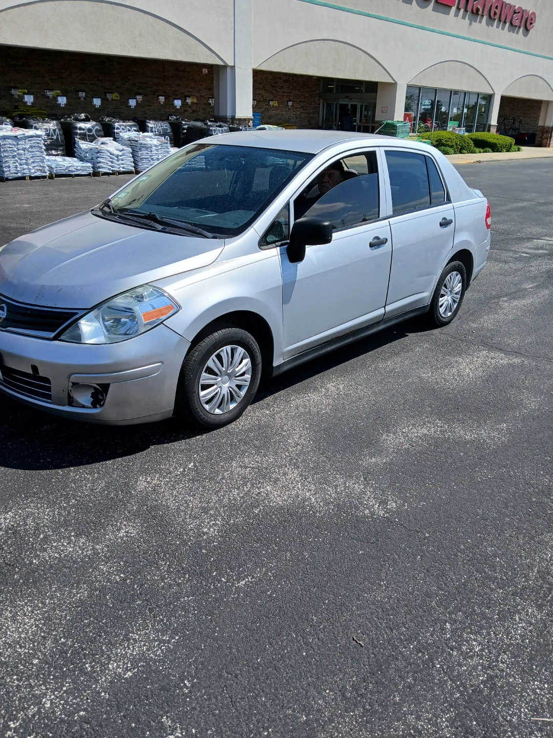 Silver Nissan Versa Sedan