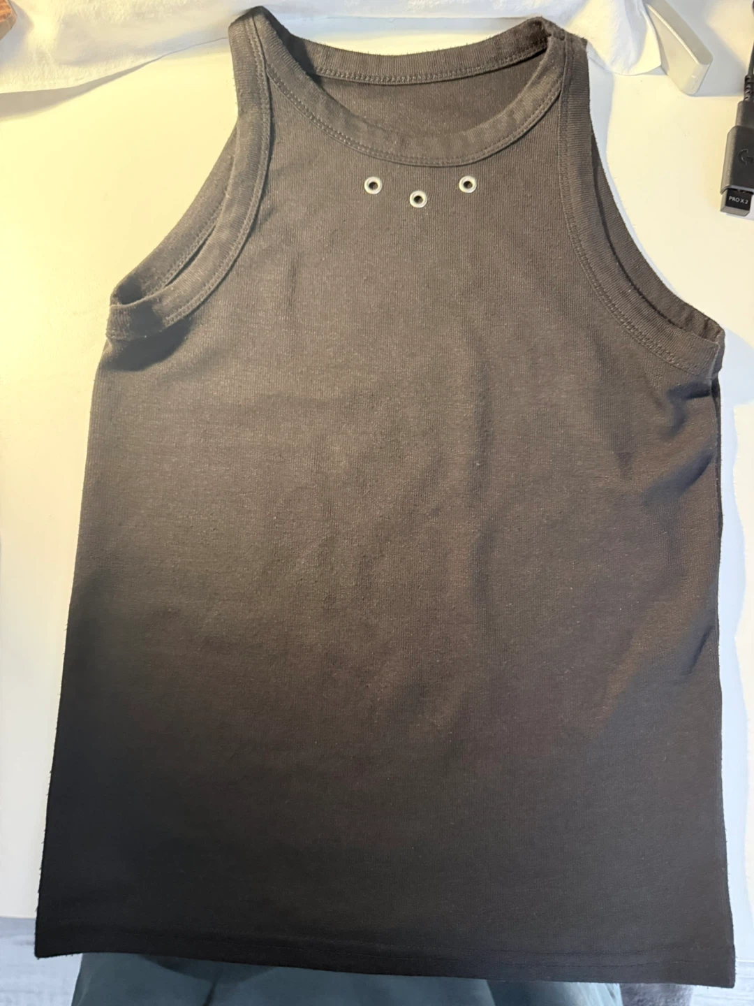 Black ribbed tank top with grommets