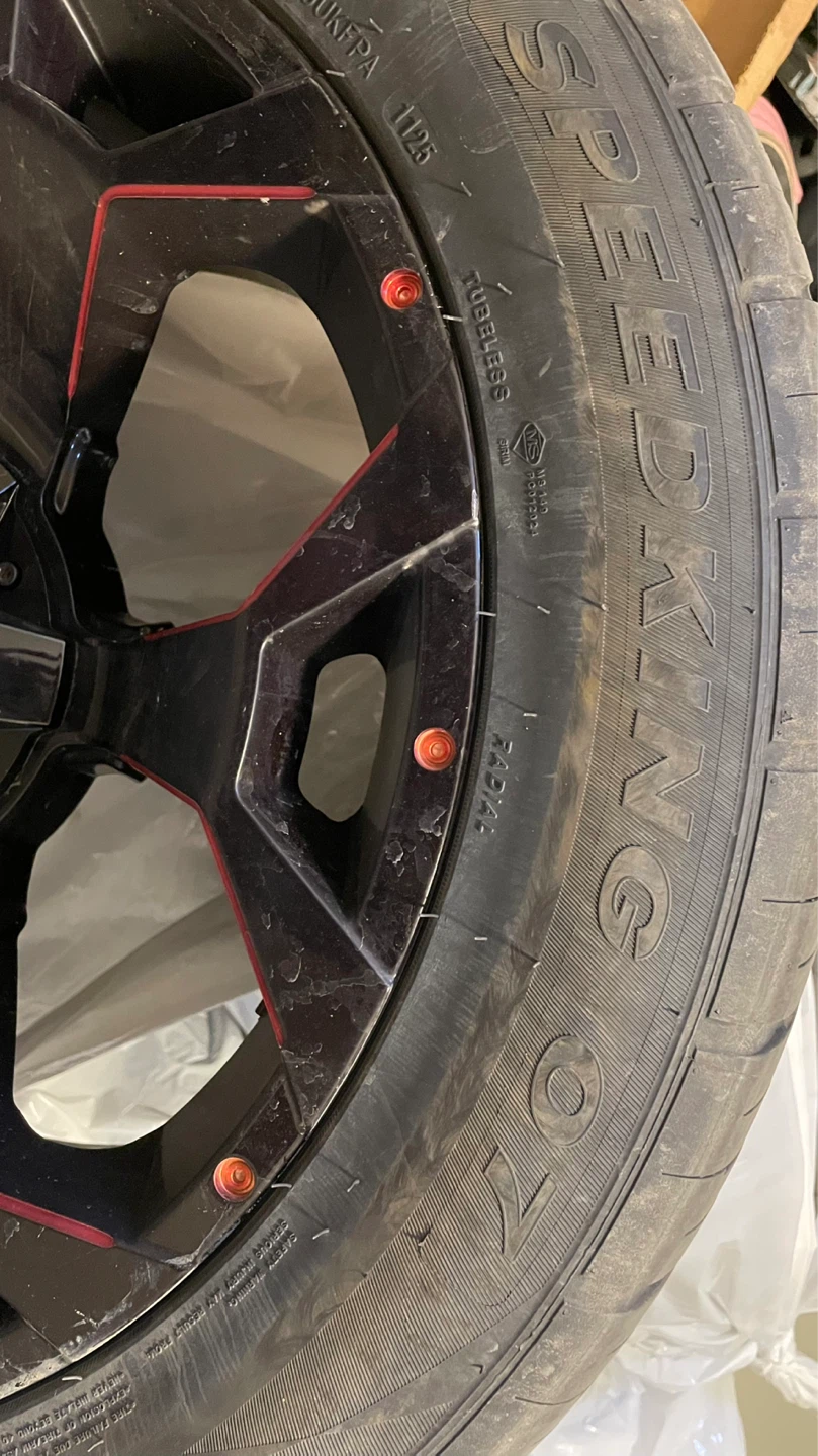 Speed King 295/45ZR20 Tire with Custom Black and Red Rim