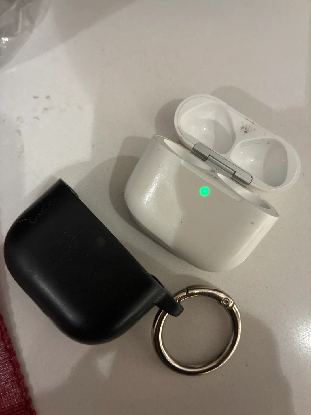 Apple AirPods 4 Charging Case and Black Cover