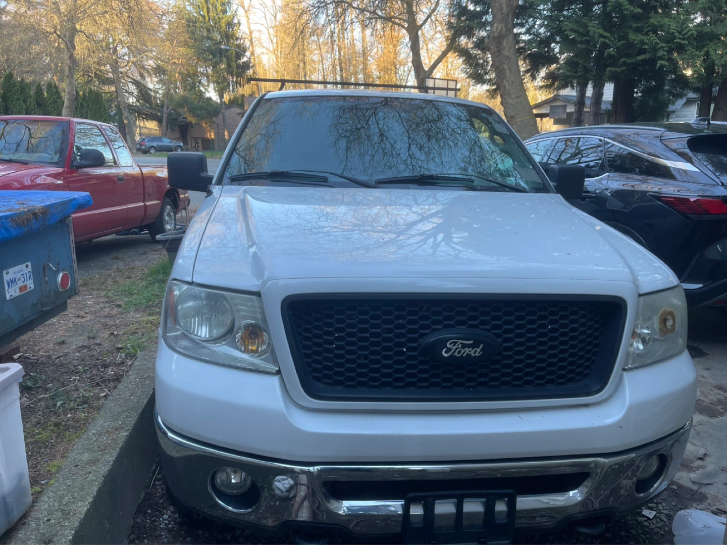 White Ford F-150 FX4 Off Road Truck with Topper