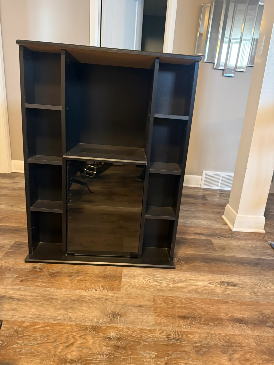 Black bookshelf with glass door