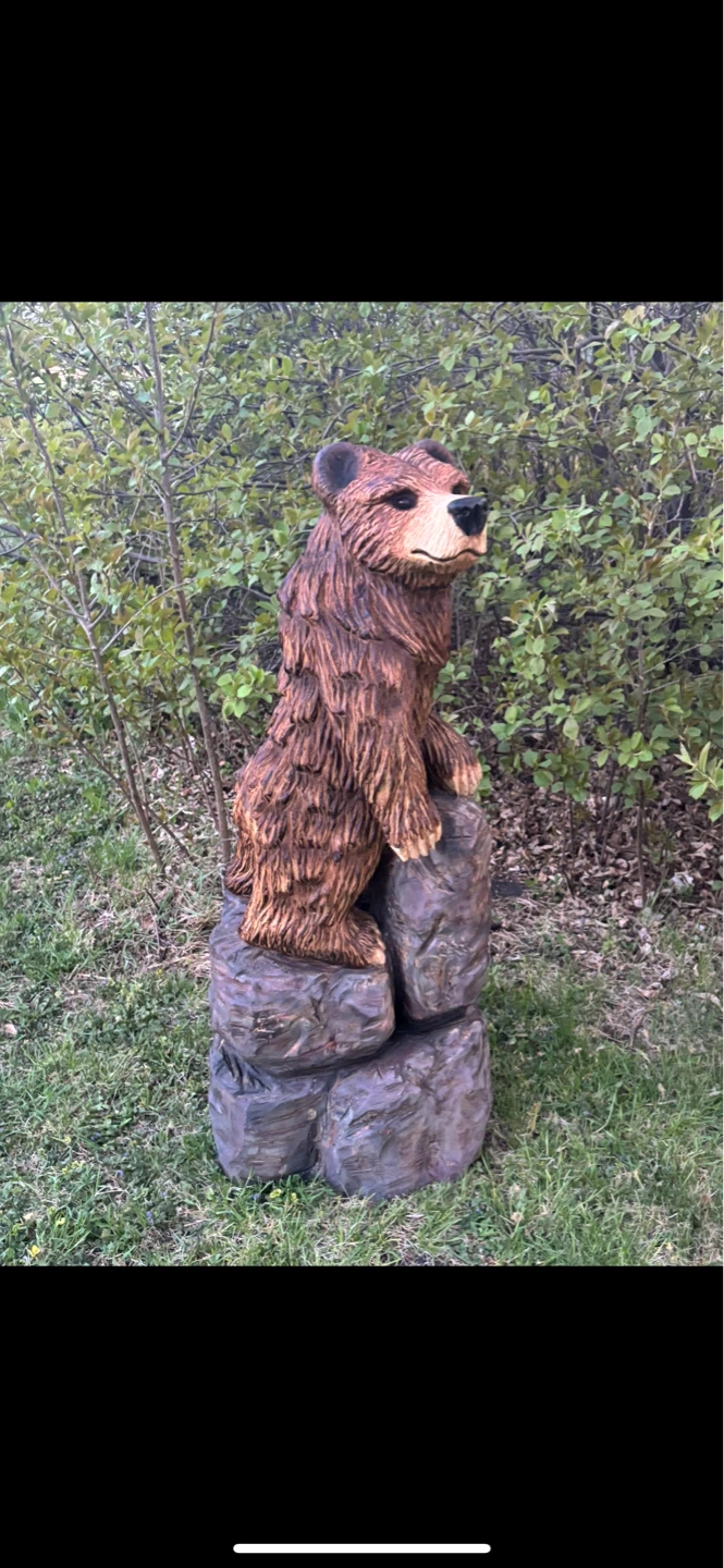 Hand Carved Wooden Bear Sculpture on Rocks