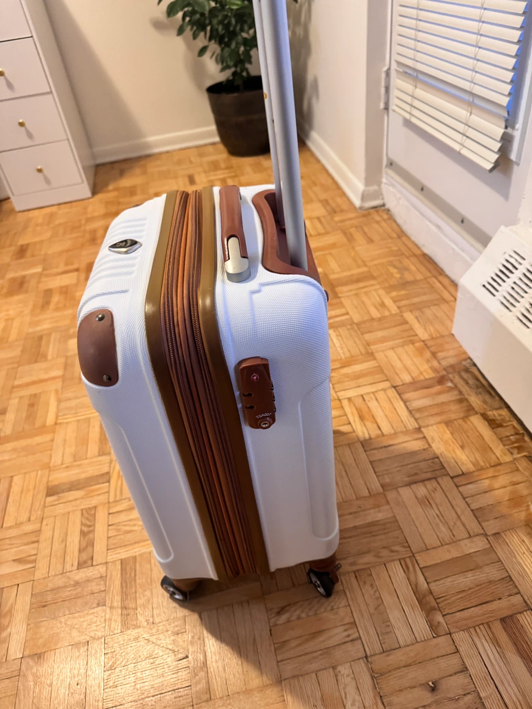 White Spinner Suitcase with Brown Accents