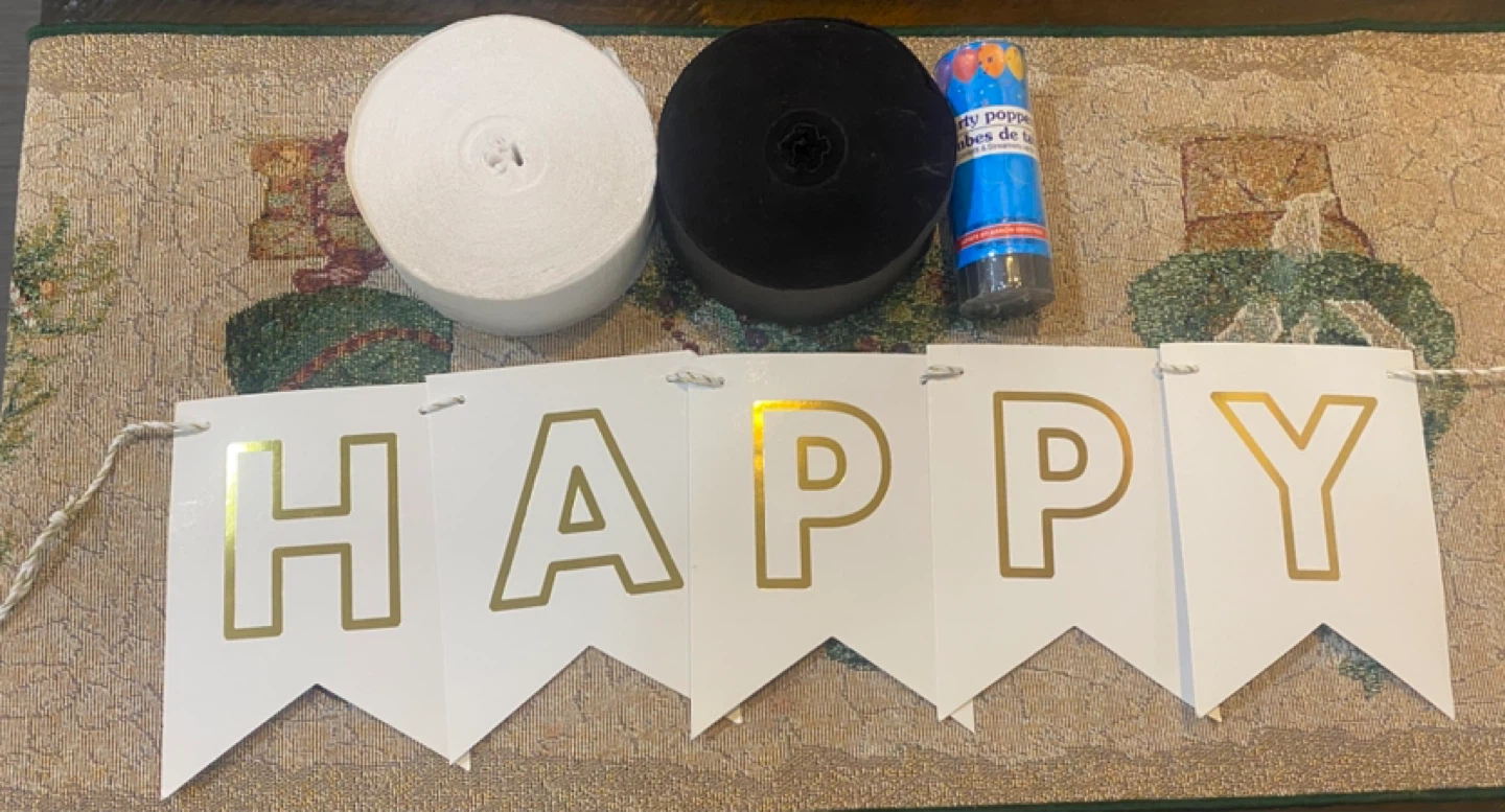 Happy Birthday Banner with Streamers and Party Popper