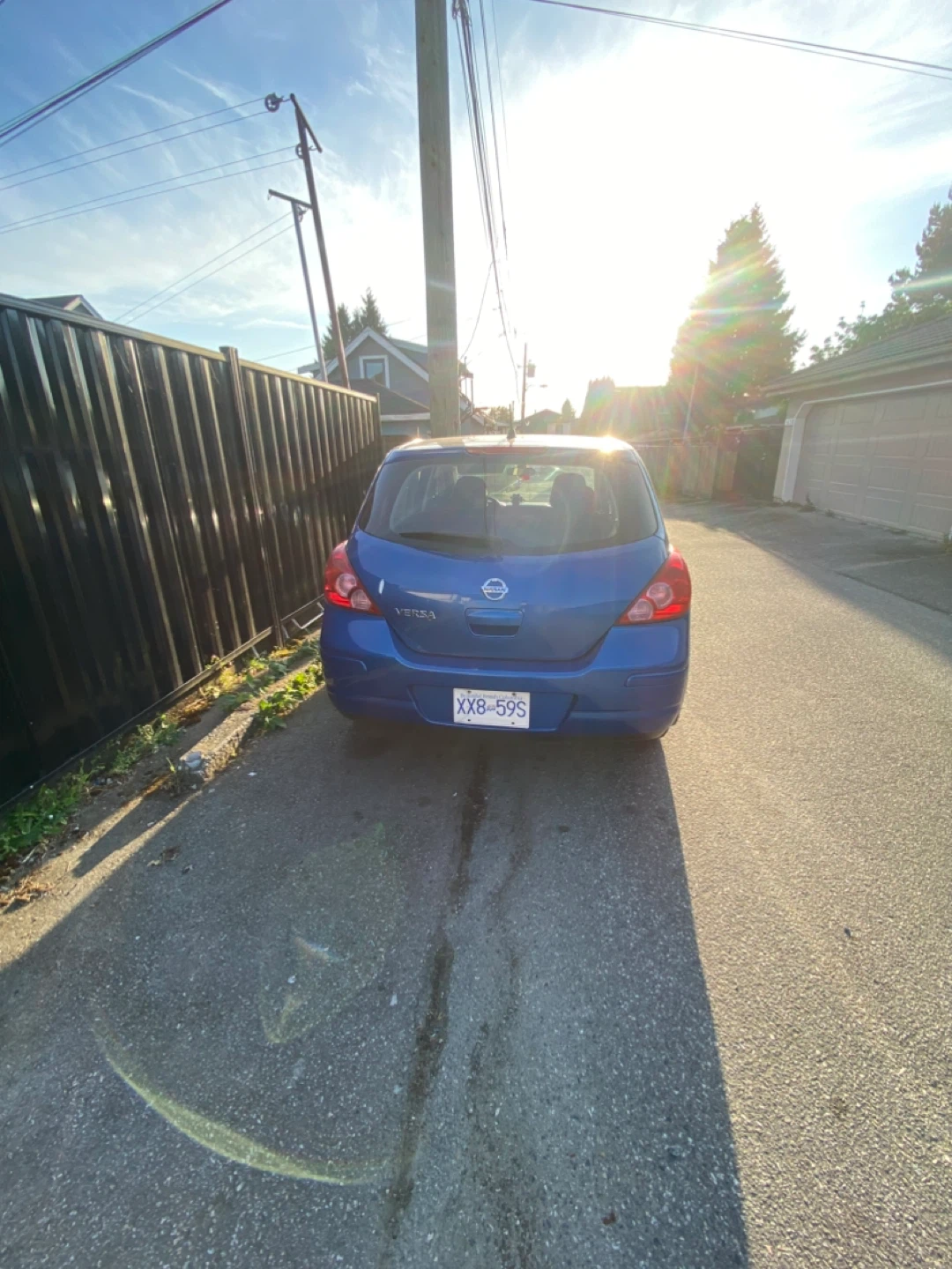 Blue Nissan Versa Hatchback - photo 3
