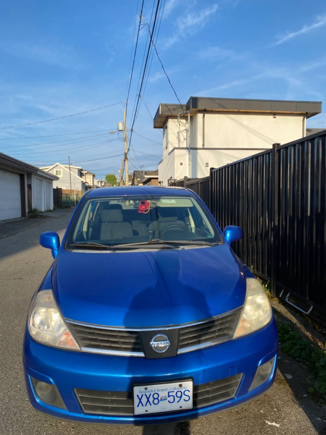 Blue Nissan Versa Hatchback