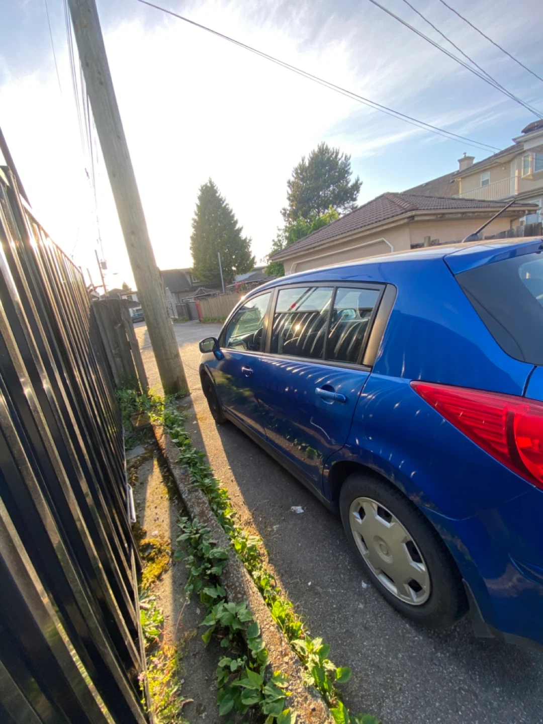 Blue Nissan Versa Hatchback - photo 4