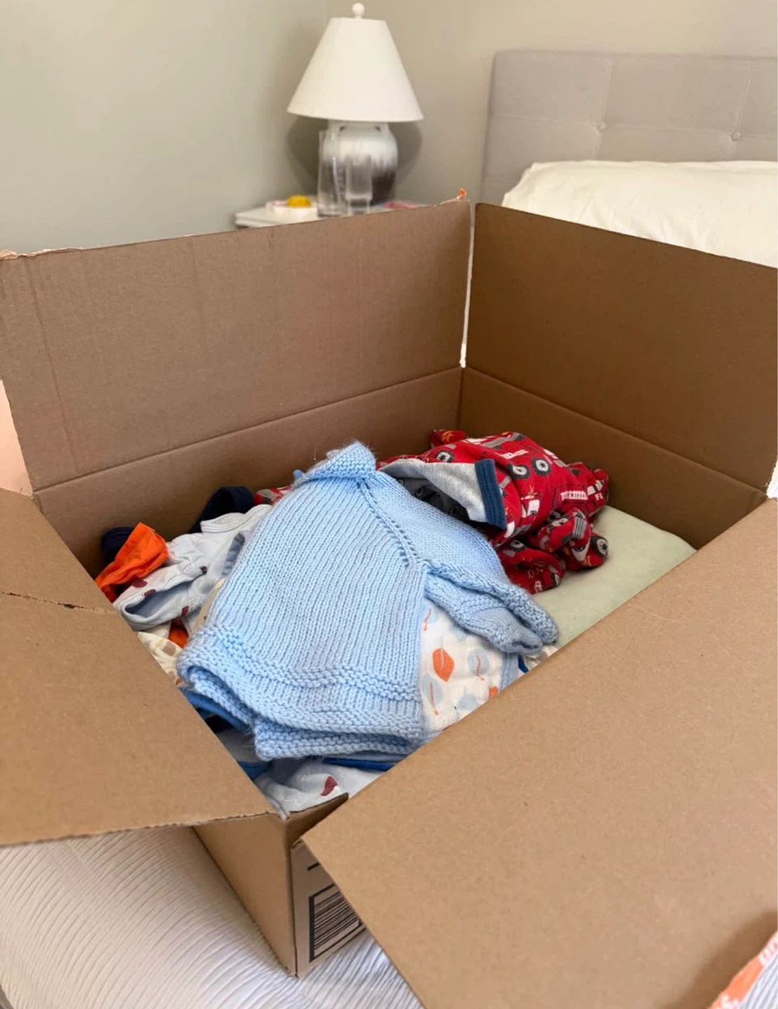 Box of assorted baby clothes 0-6 months