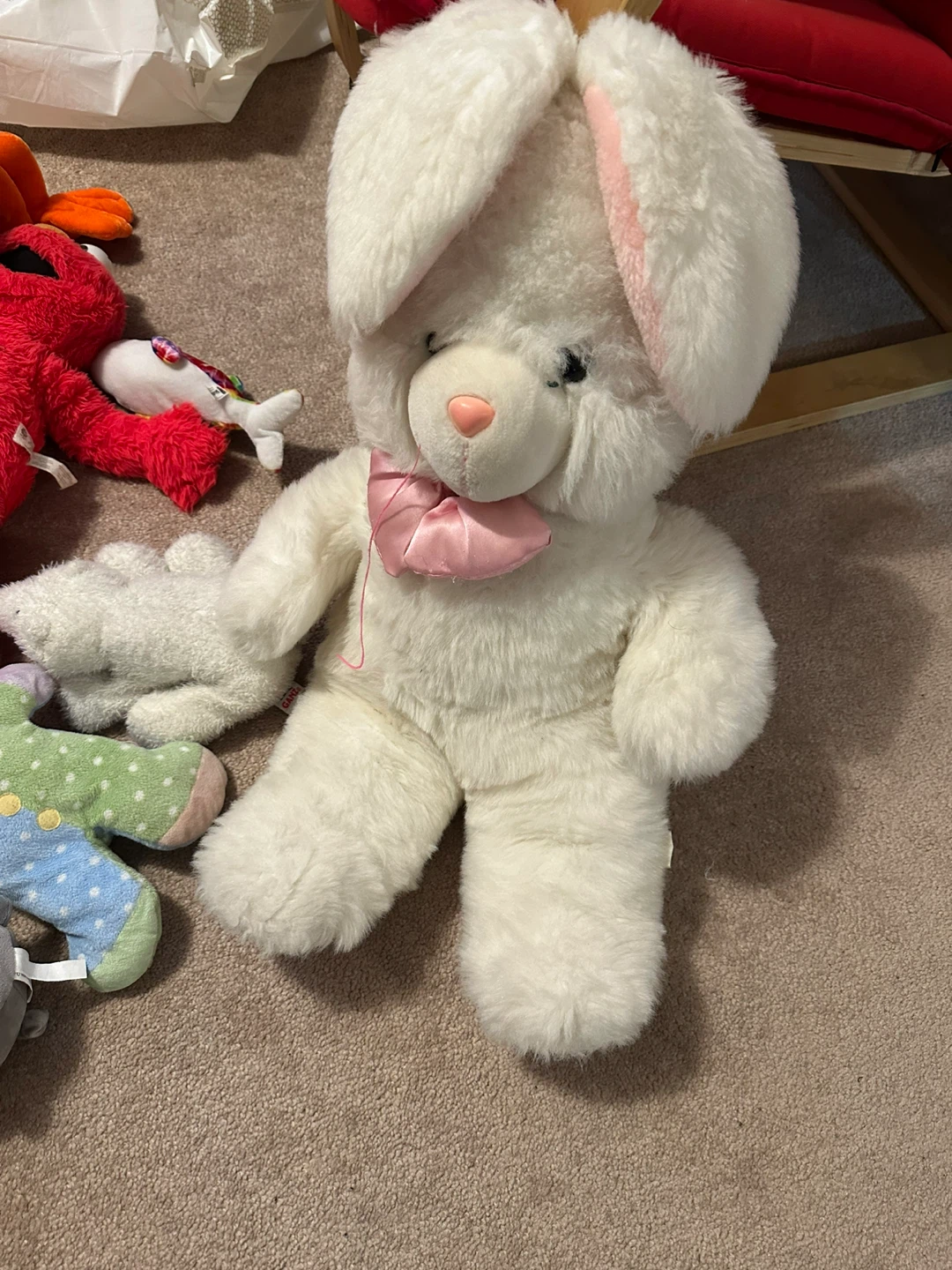 White plush bunny with pink bow
