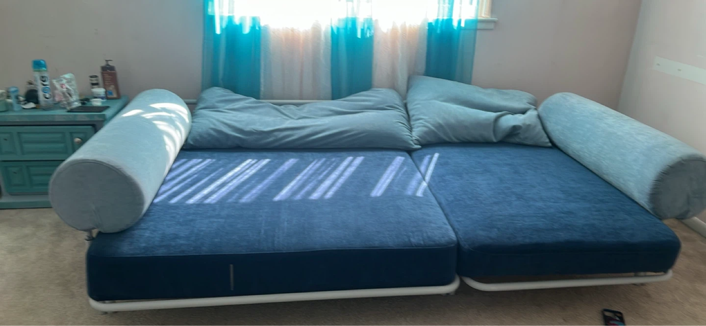 Blue Sofa Bed with Bolster Pillows