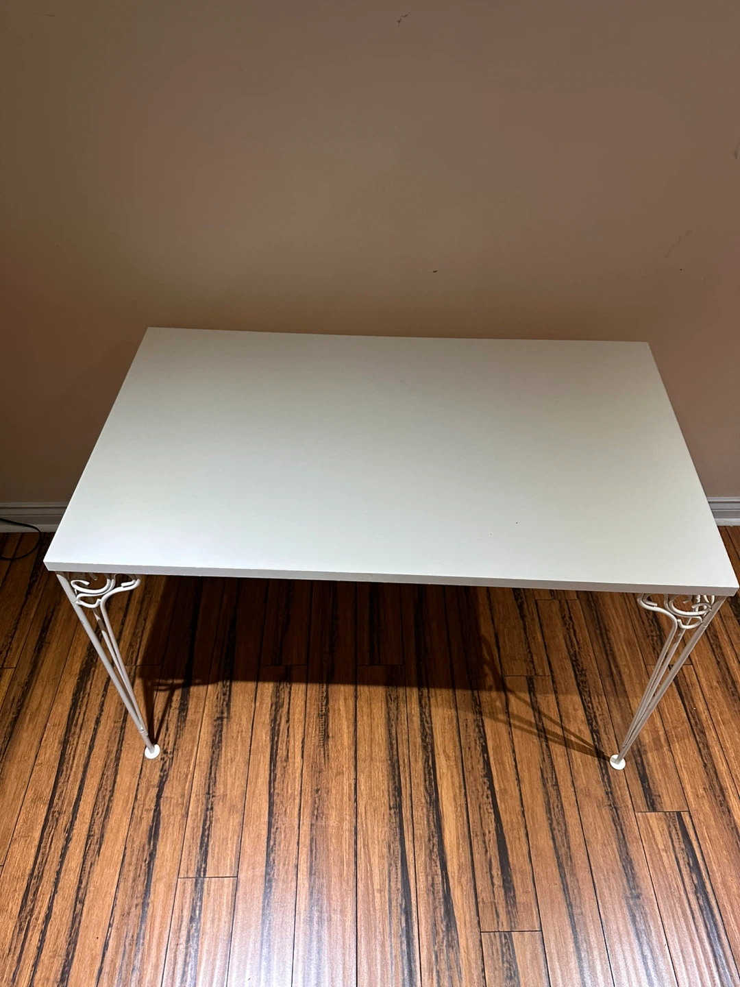 White Table with Decorative Metal Legs
