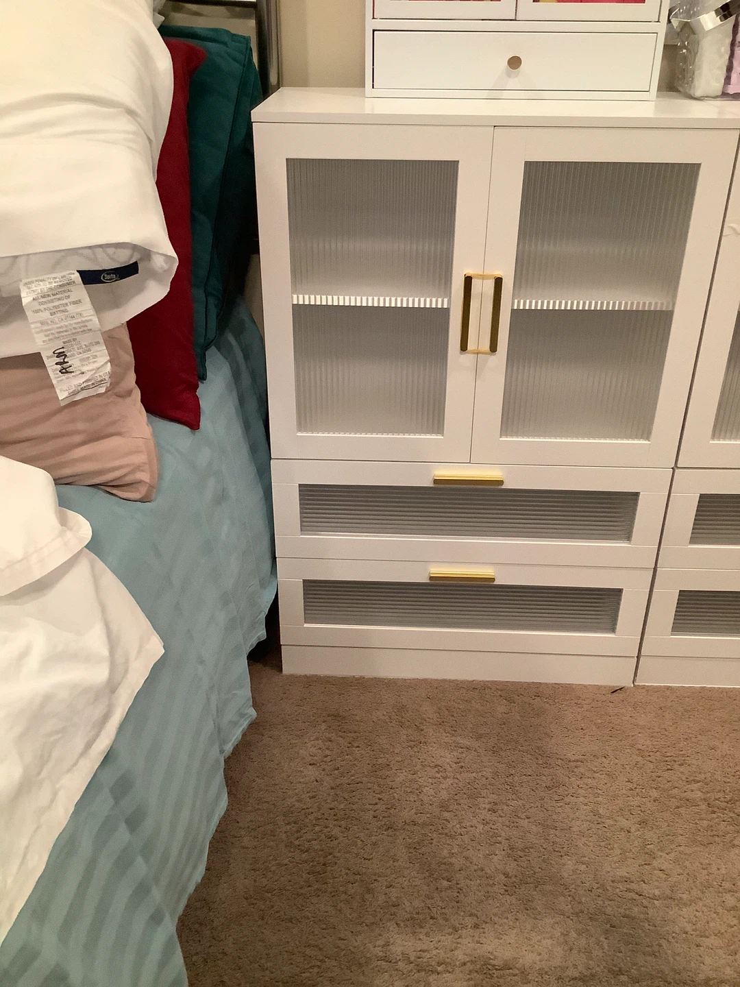 White Cabinet with Glass Doors and Gold Handles
