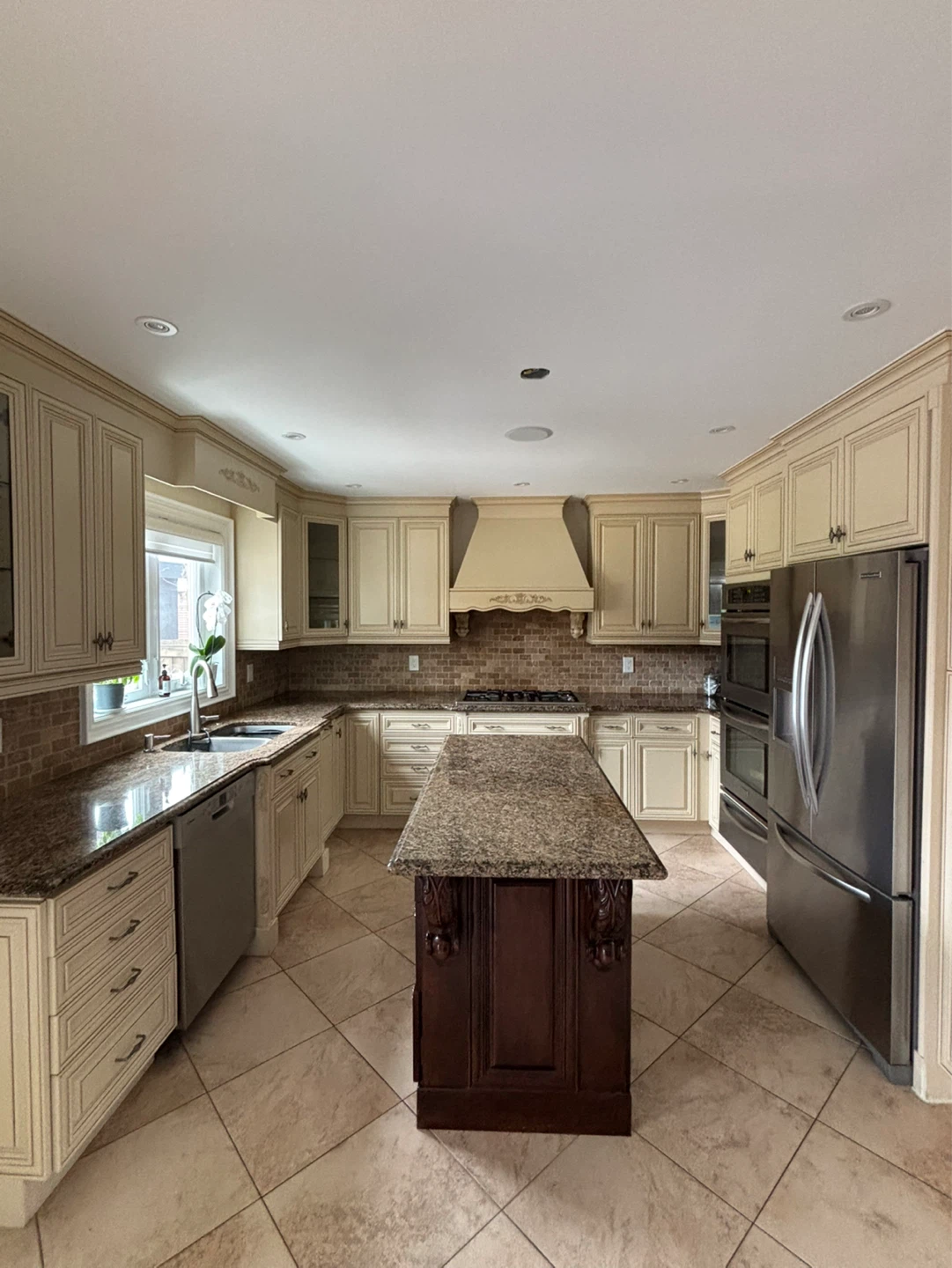 Full kitchen cabinets and island with granite counter tops
