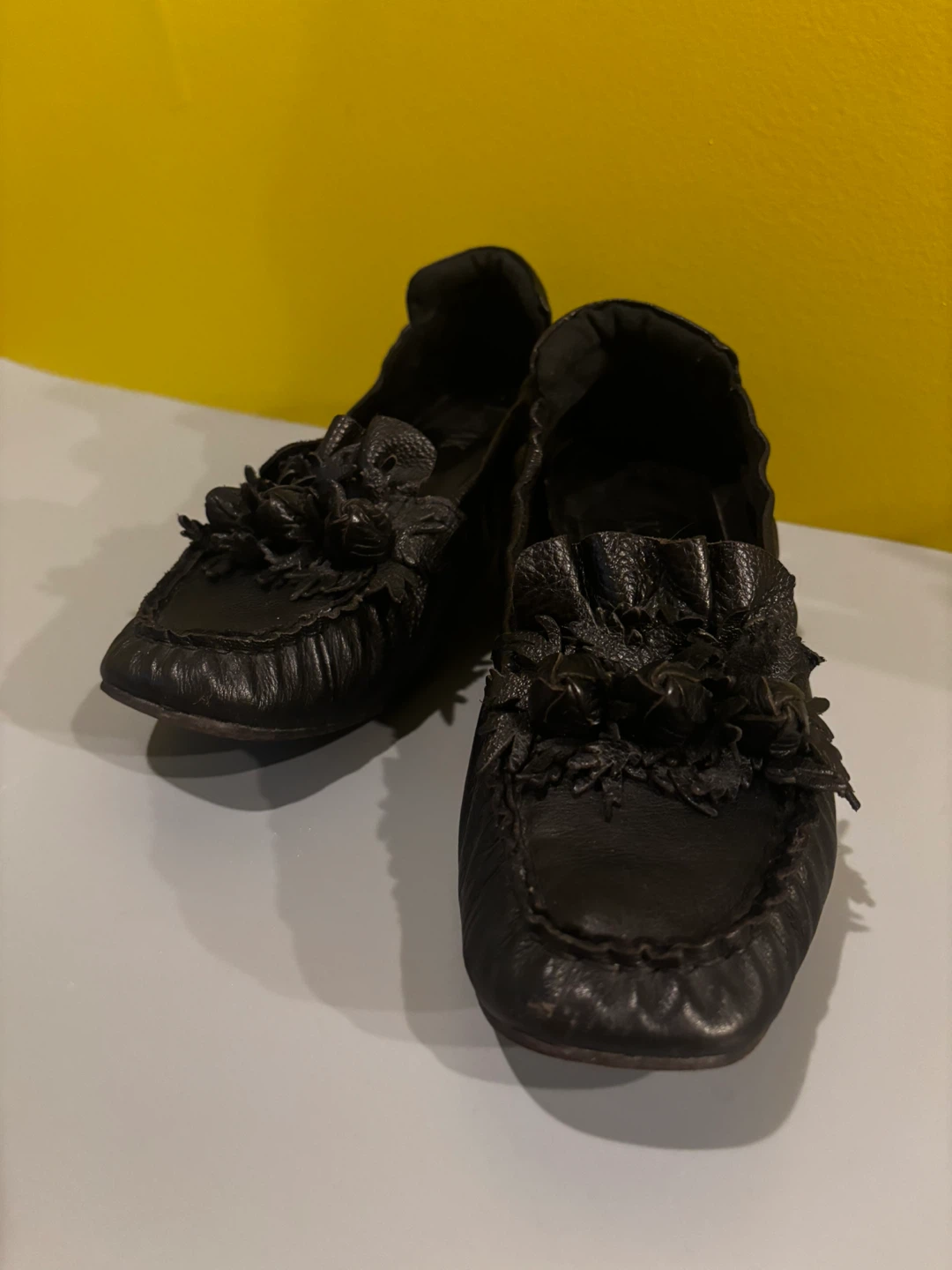 Black Leather Loafers with Floral Embellishment