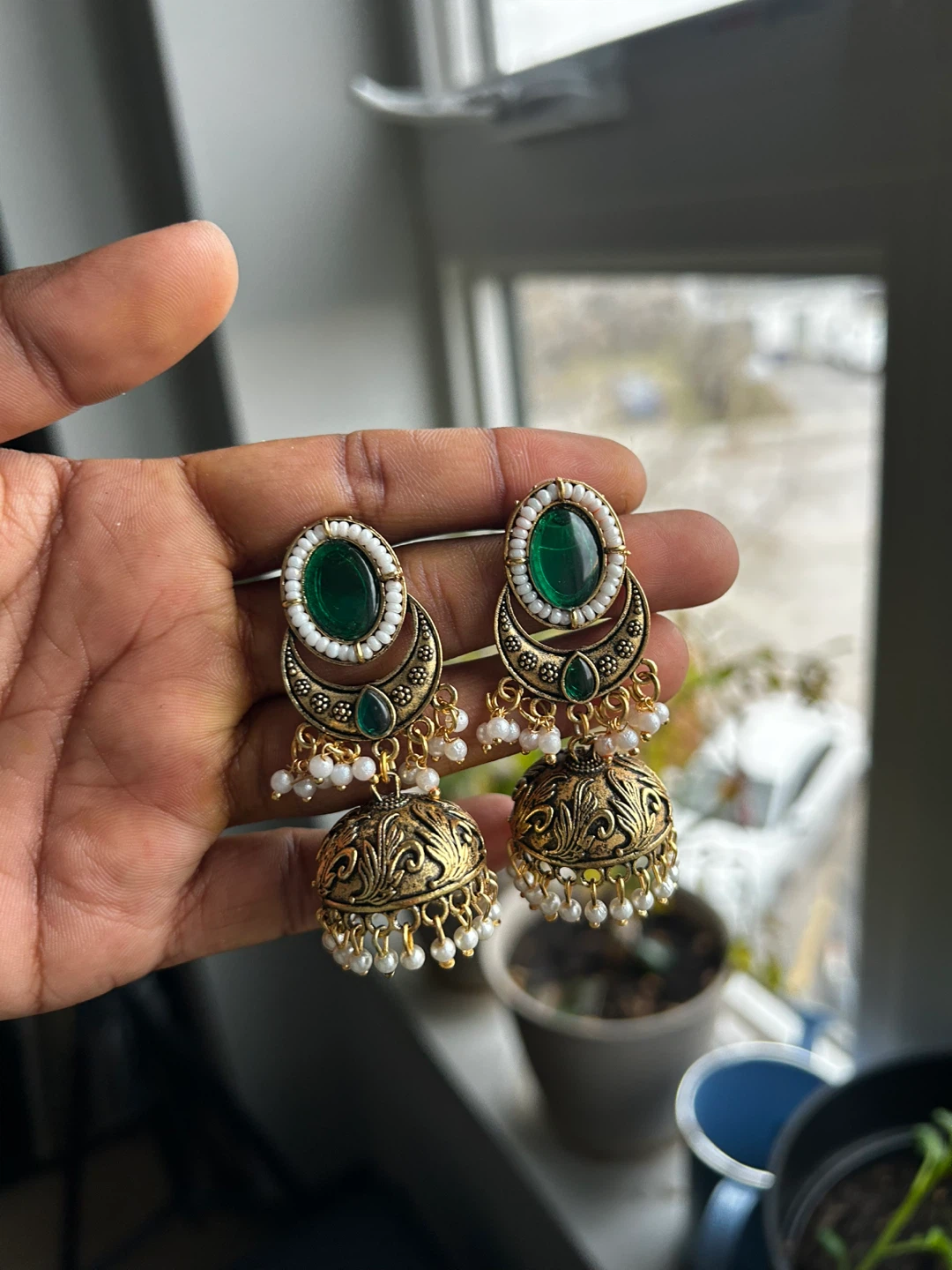 Gold-tone Jhumka Earrings with Green Stones and White Beads