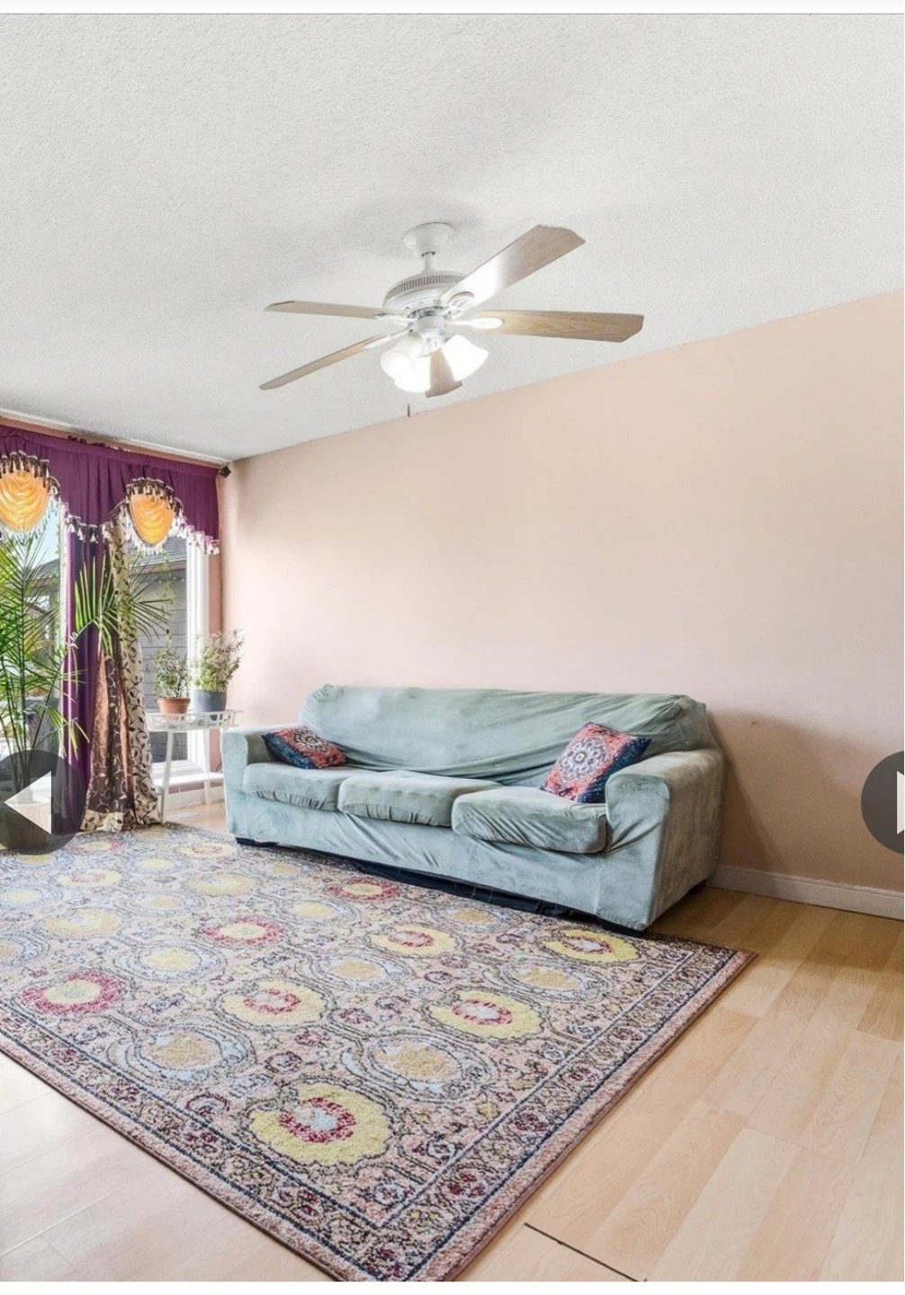 Light Blue Sofa with Patterned Pillows