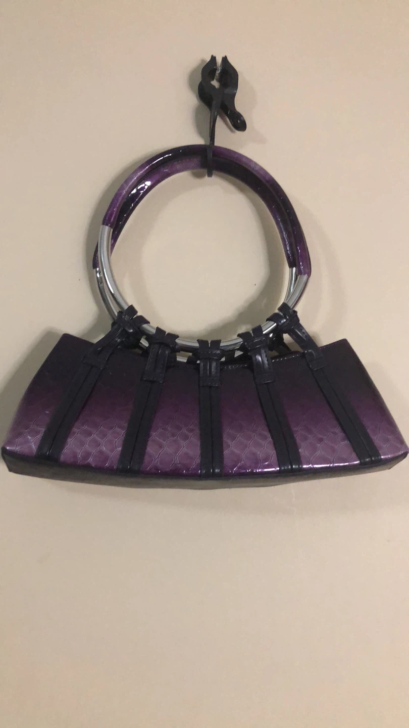 Purple patent handbag with silver ring handles