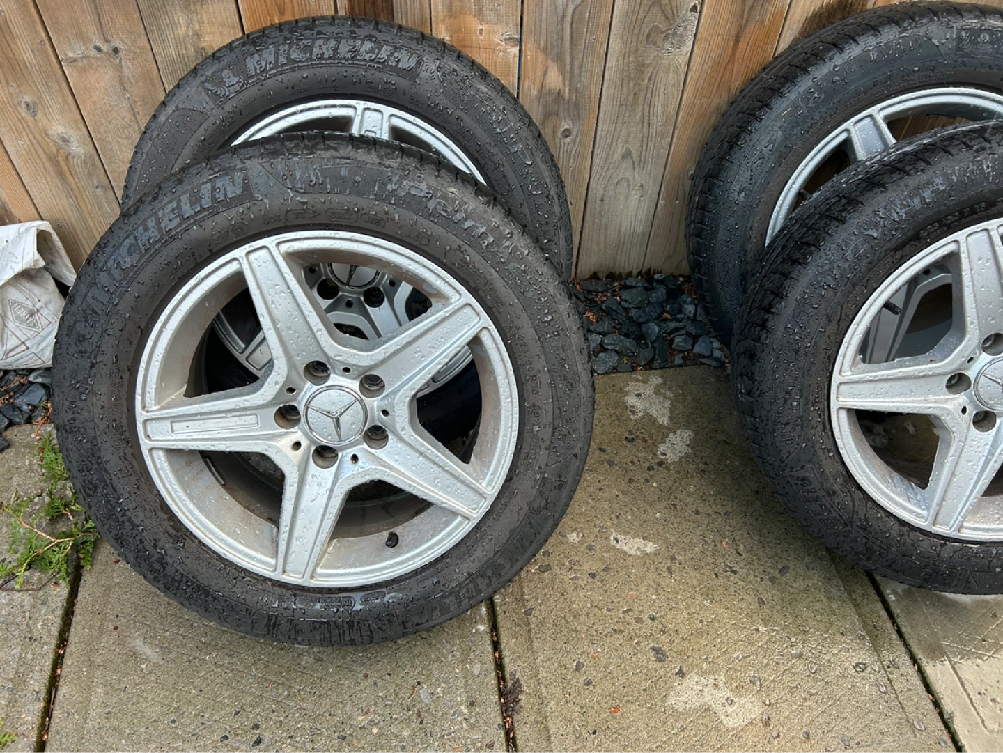 A set of four all season tires on alloy rims