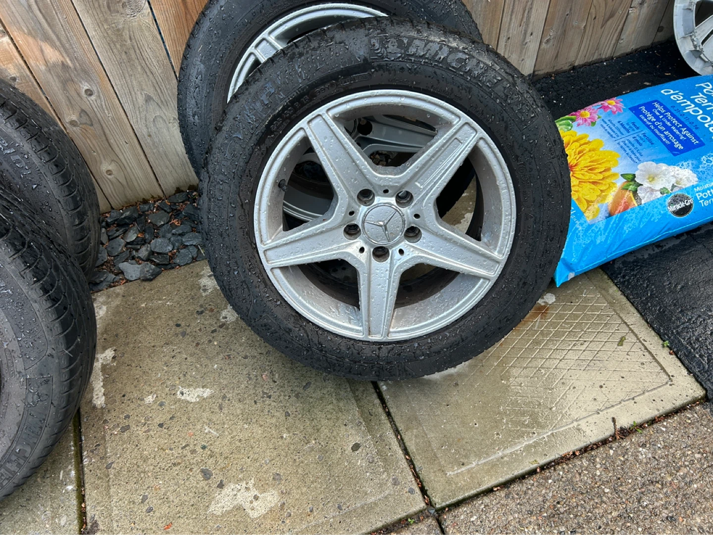 A set of four all season tires on alloy rims - photo 2