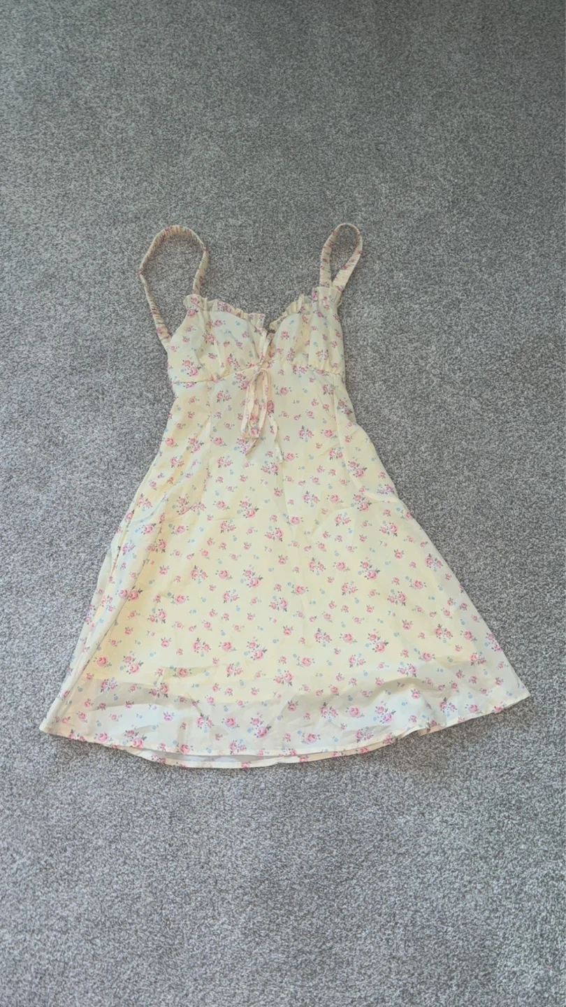 Yellow floral mini dress with tie front