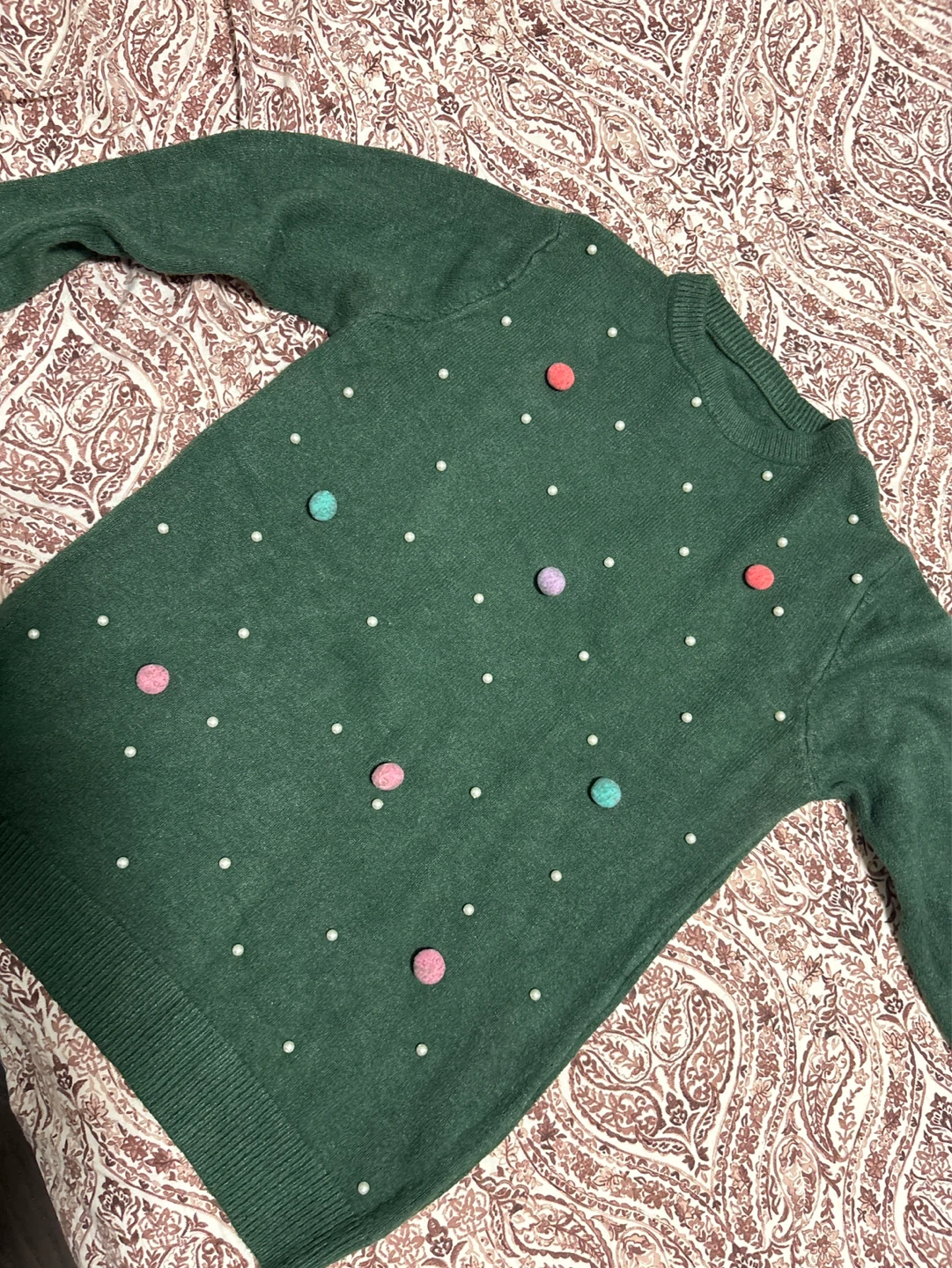 Green Sweater with Pom-Poms and Pearls
