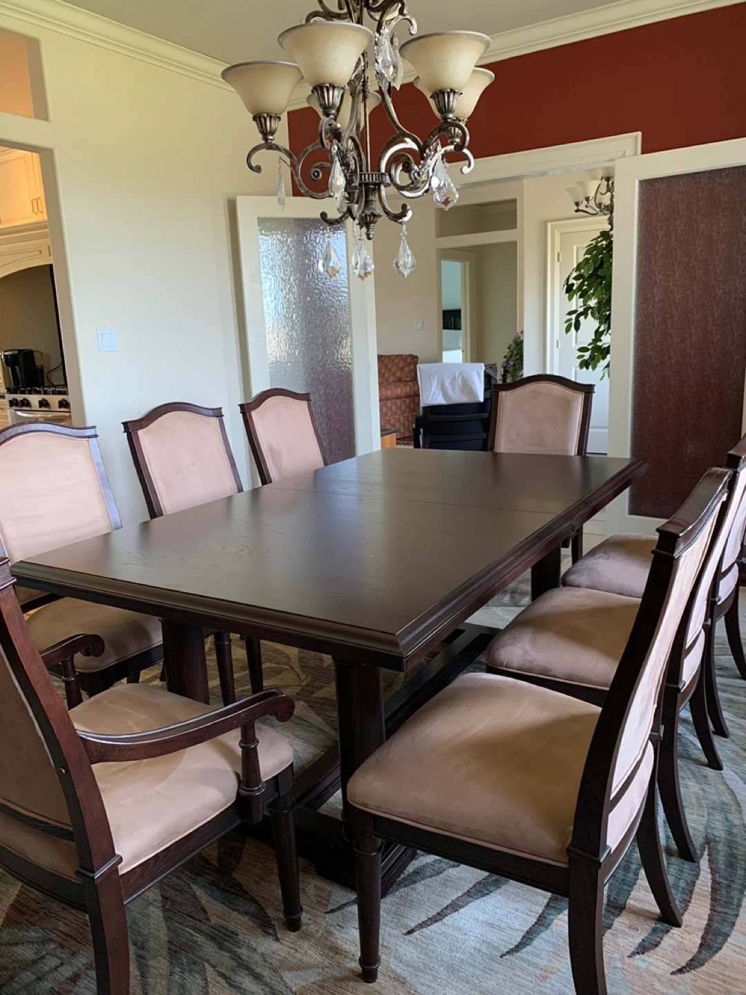 Dark wood dining room table with 8 chairs