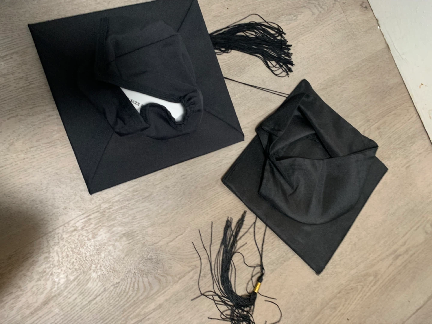 2 Black Graduation Caps with Tassels